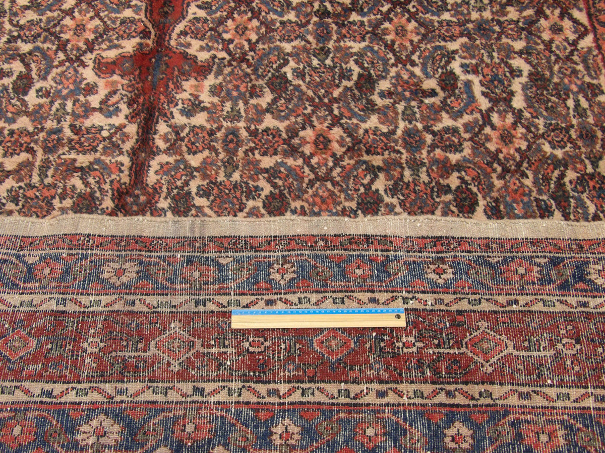Beige & Red Antique Sherapi rug in room setting