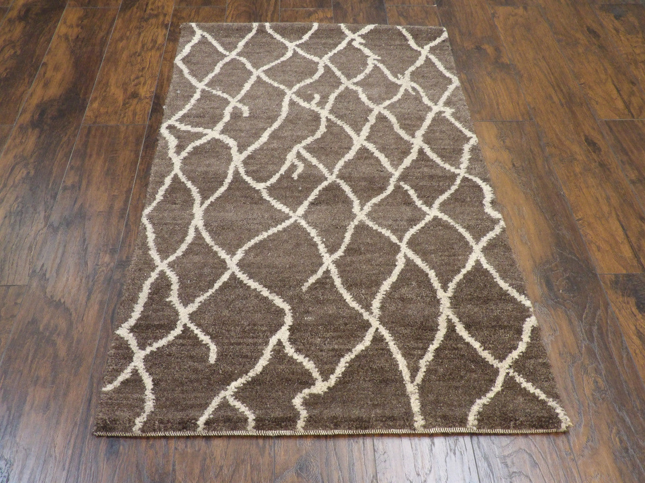 Close-up of wool pile, brown rug