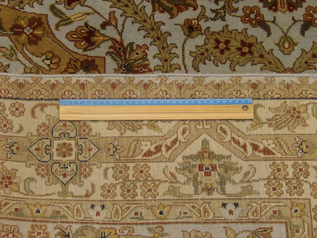 Blue and gold Haji Jalili rug in room setting
