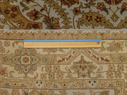 Blue and gold Haji Jalili rug in room setting