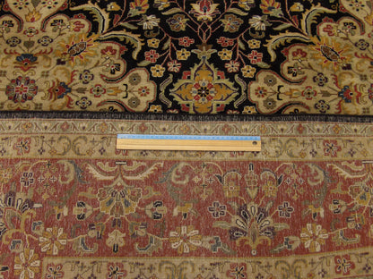 Black & Red Fine Persian Haji Jalili rug in room setting