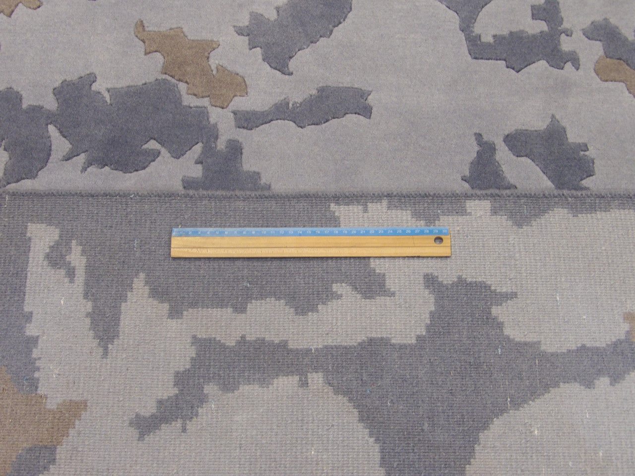 Full room view of modern abstract marble hand-knotted rug