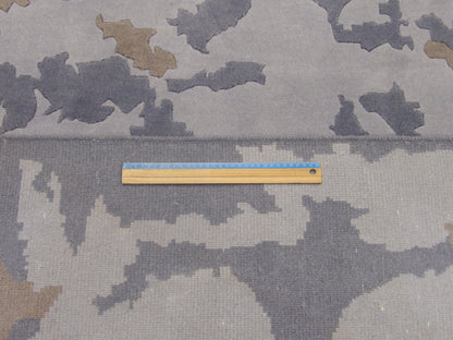Full room view of modern abstract marble hand-knotted rug
