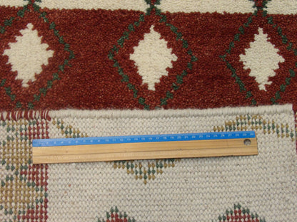 Beige & Red Moroccan rug in room setting