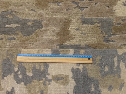 Gold and gray abstract rug in room setting