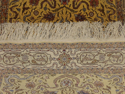 Gold Tabriz rug in room setting
