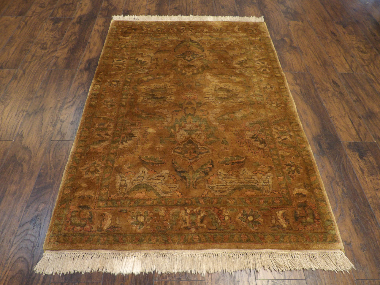 Close-up of wool pile, gold rug