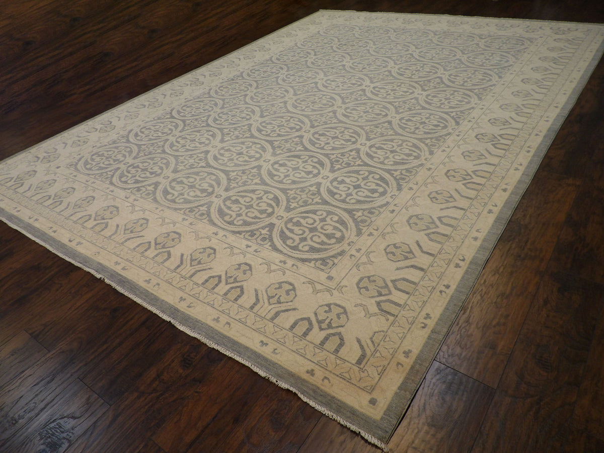 Full room view of oversized Oushak Khotan hand-knotted rug
