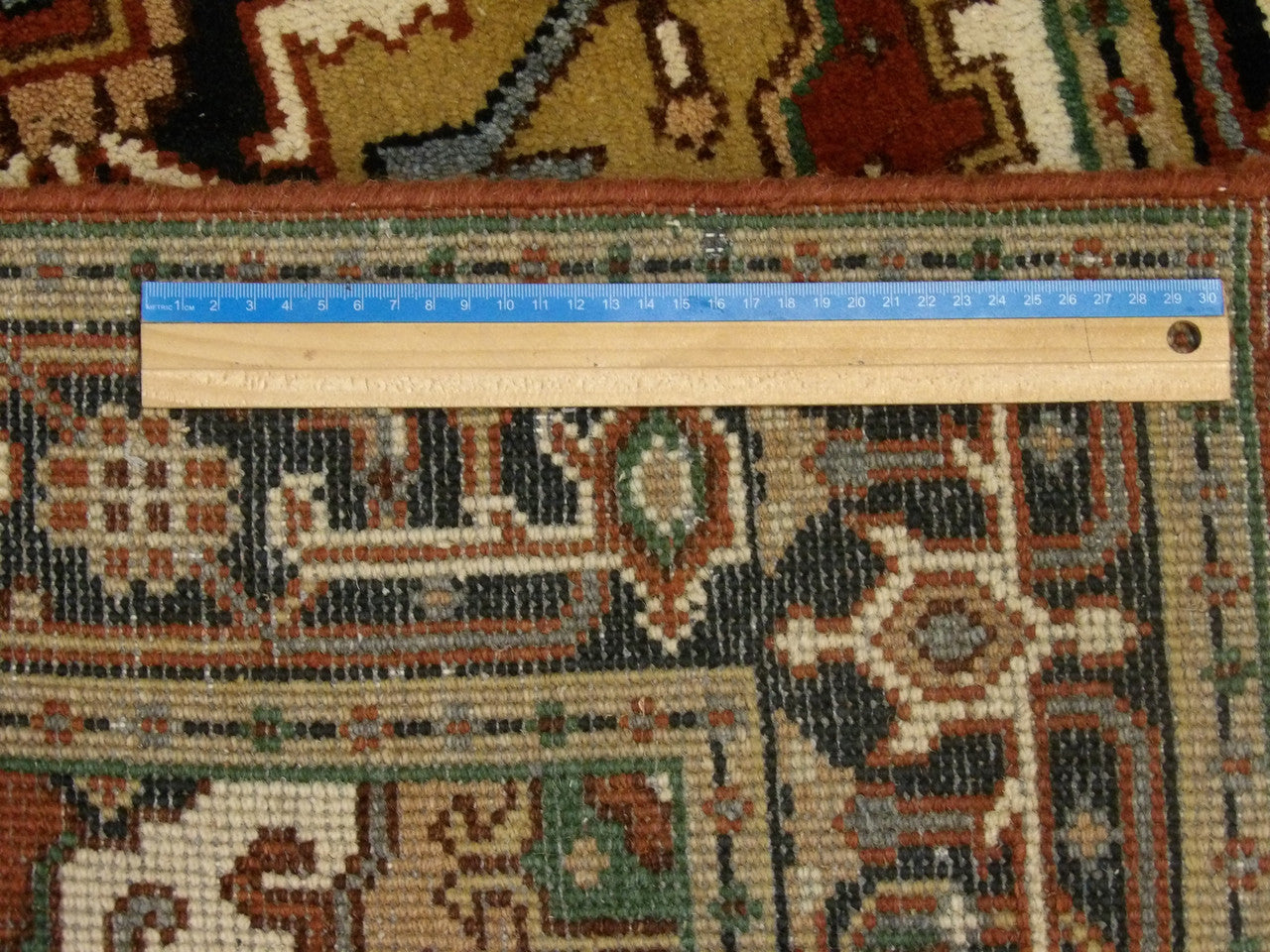 Blue & Red Heriz rug in room setting
