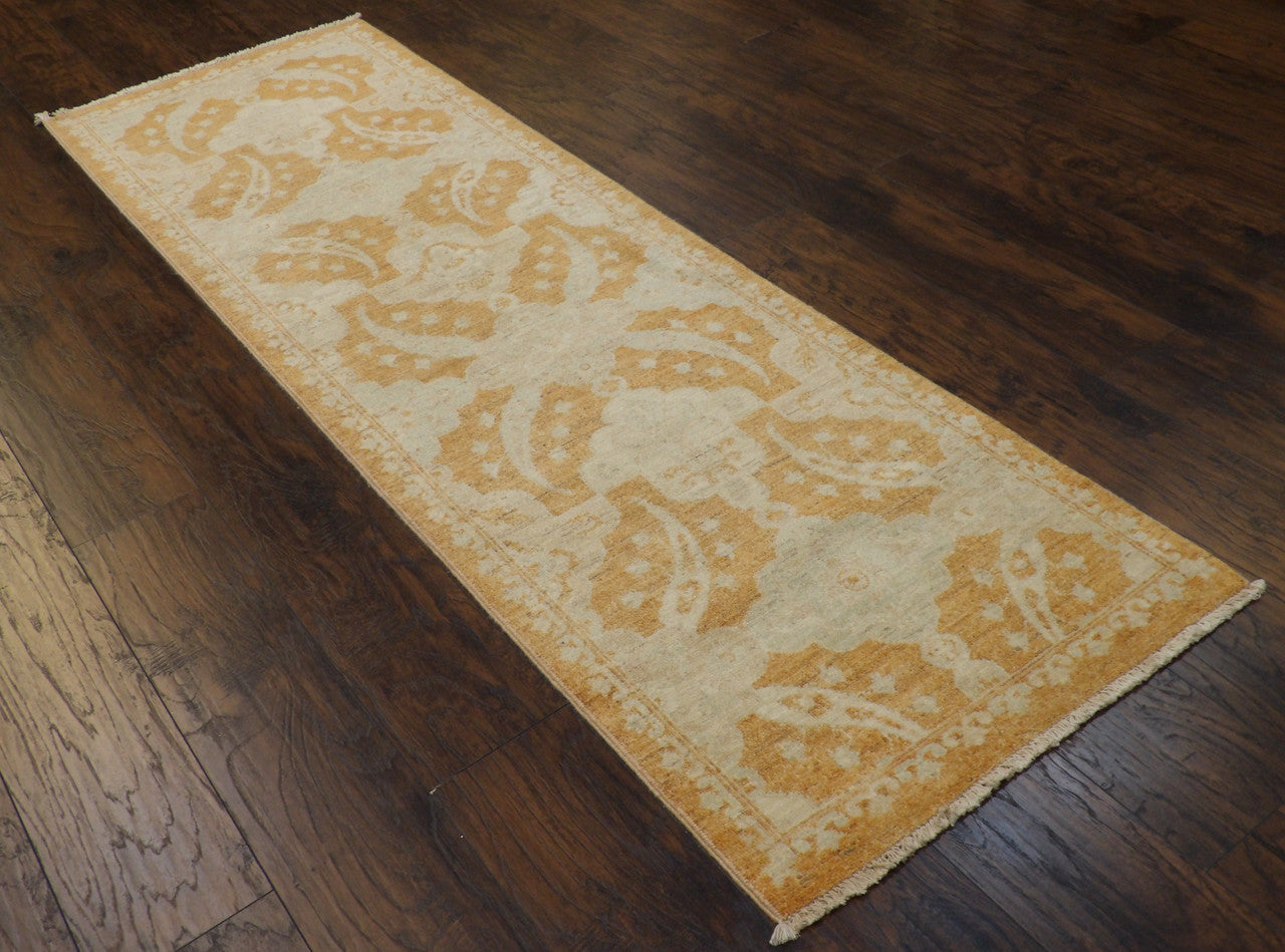 Beige and rust Oushak runner in a hallway setting