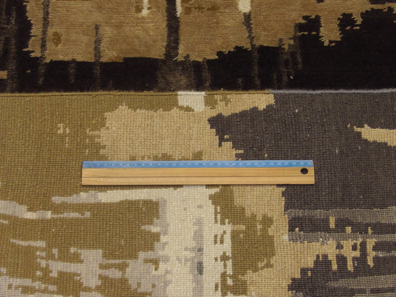 Blue and beige abstract rug in room setting