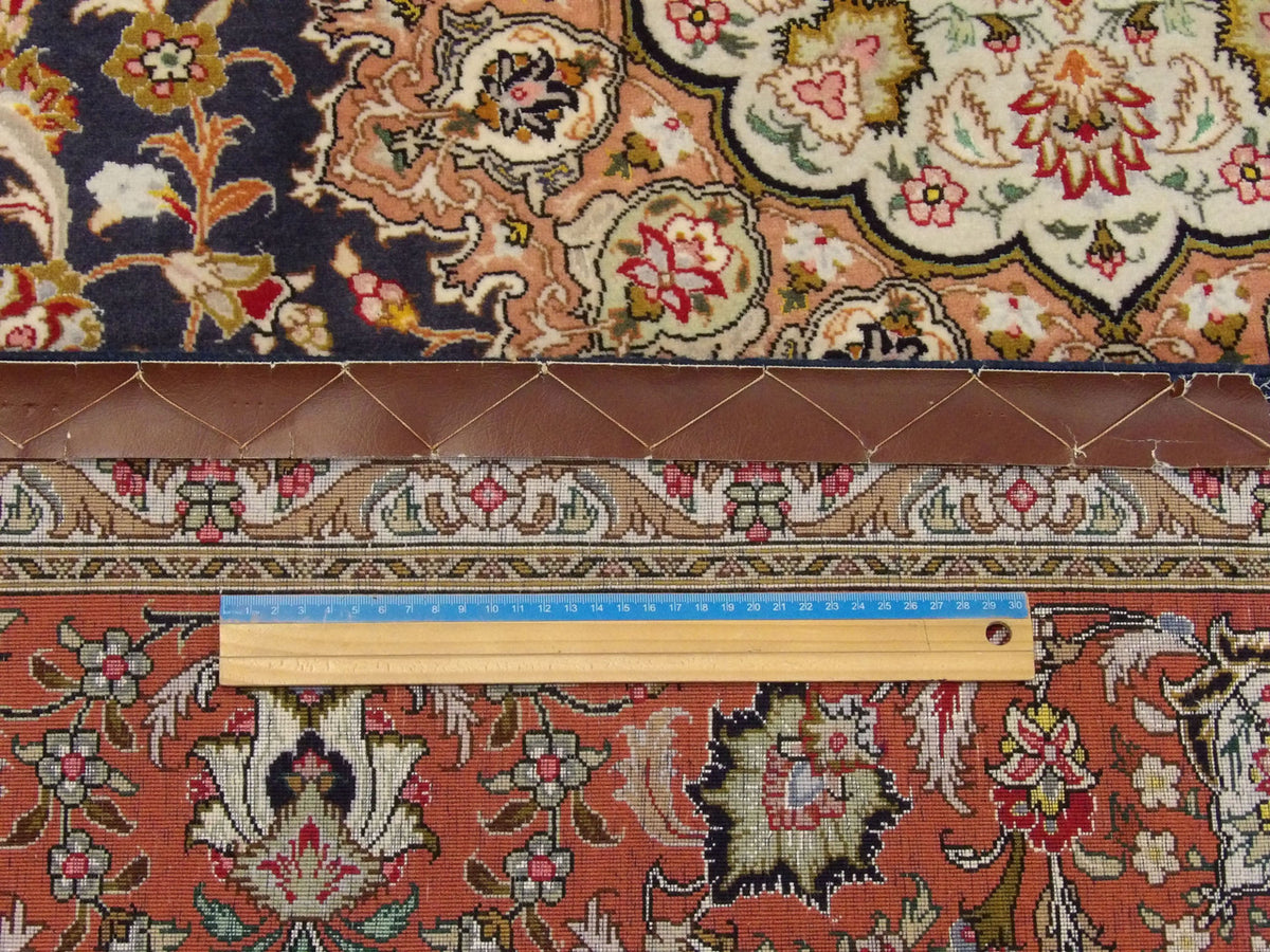 Blue and pink Qum rug in room setting