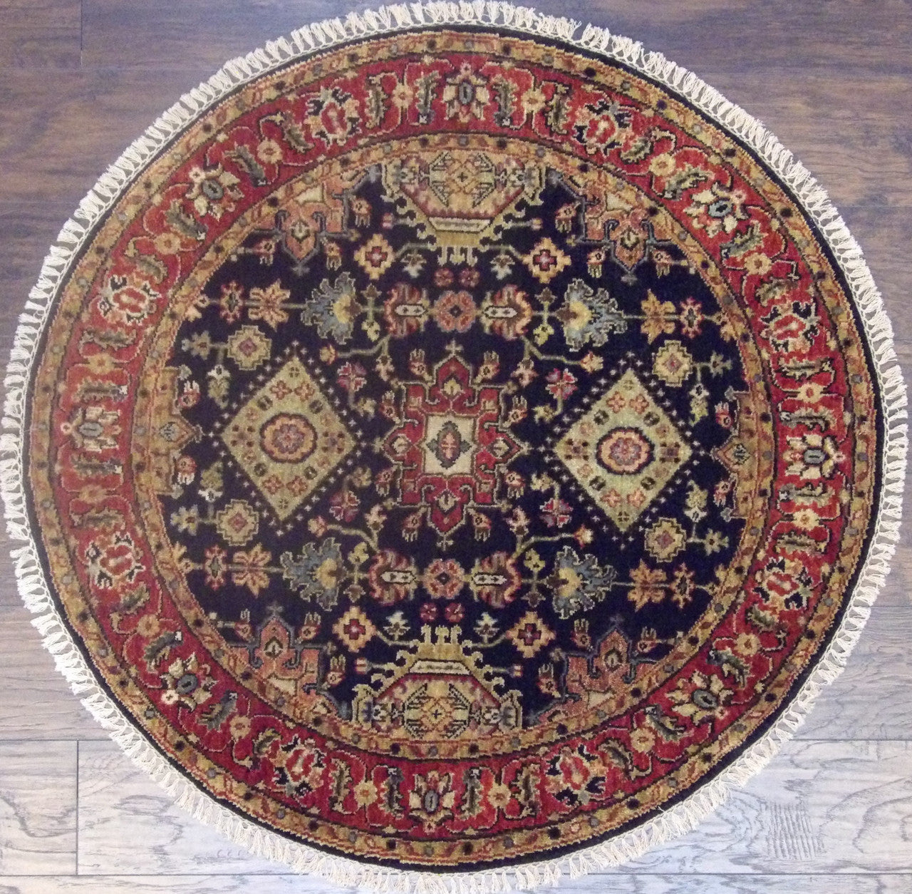 Tribal fine Serapi hand-knotted wool round rug in blue and red, full view