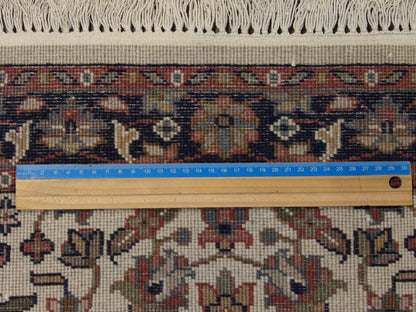 Blue and ivory Kashan rug in room setting