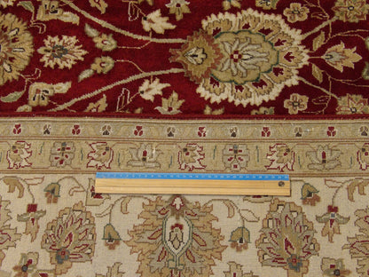 Beige & Red Fine Persian Haji Jalili rug in room setting
