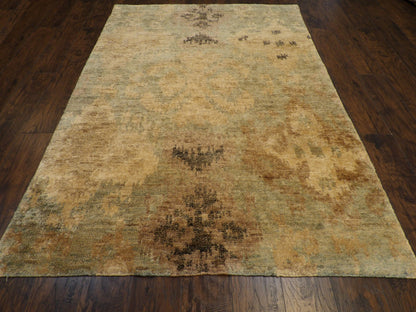 Close-up of wool-silk pile, gold and green rug