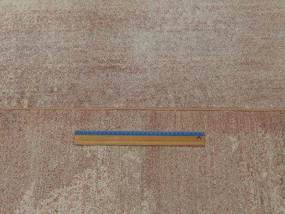 Gray and pink mosaic rug in room setting