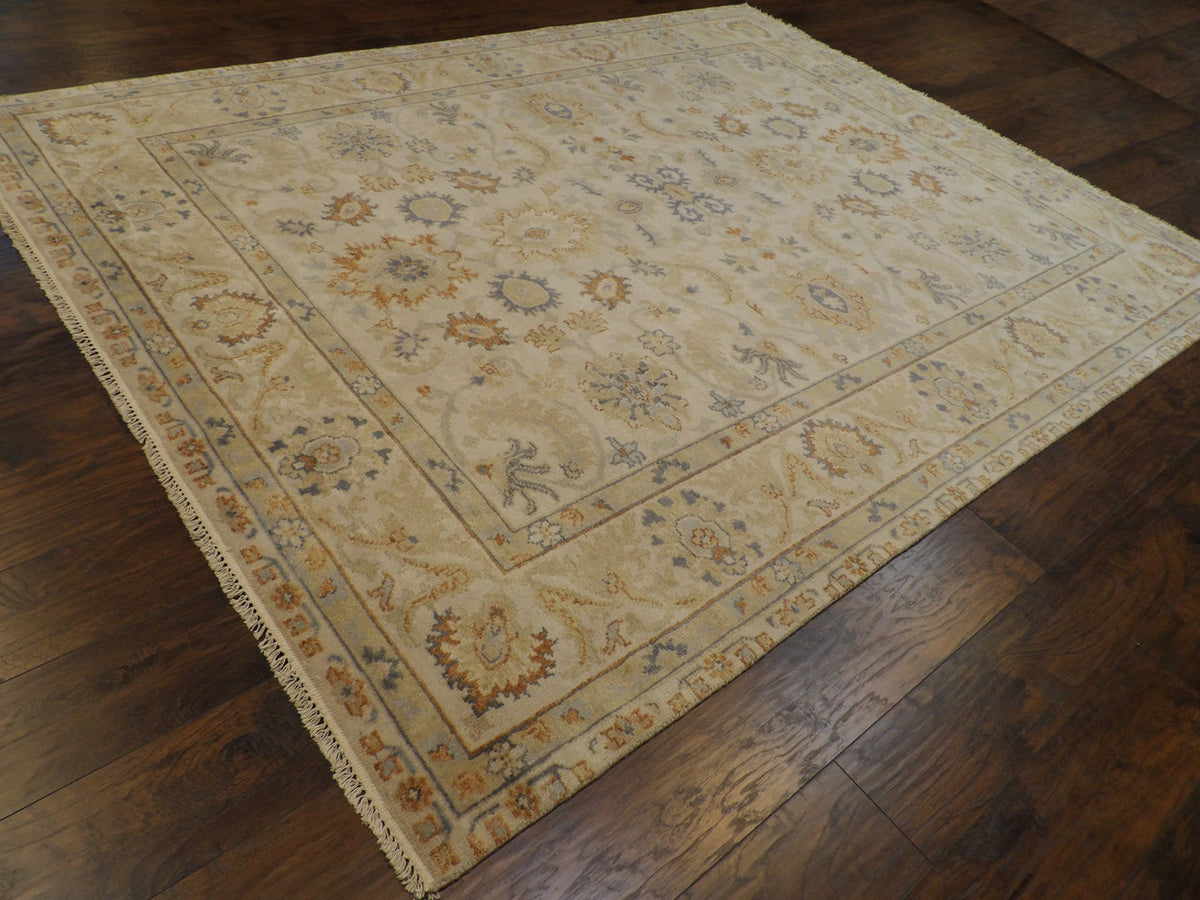 Beige and blue Oushak rug in a living room setting