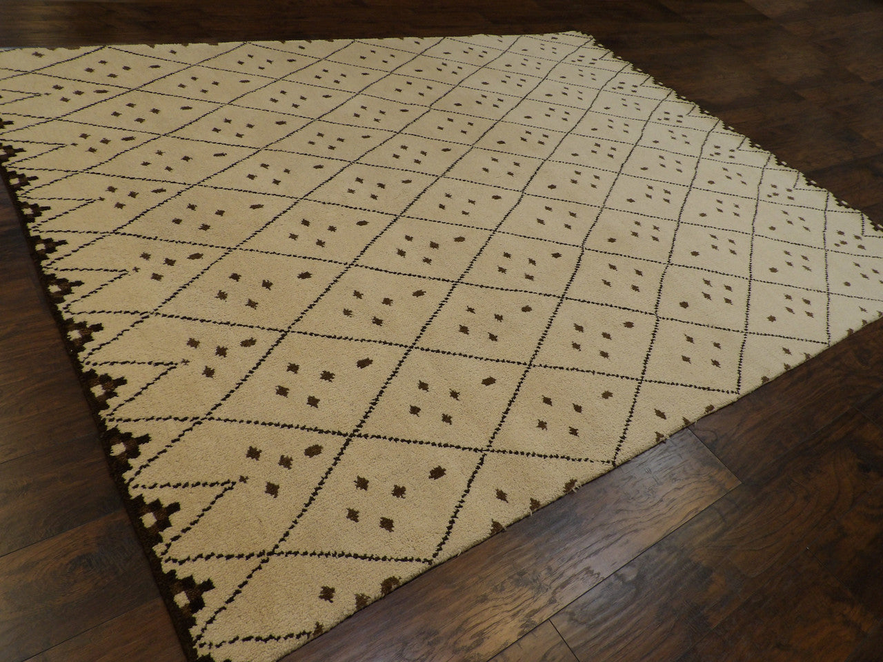 Beige and brown Moroccan Tulu rug in a living room setting