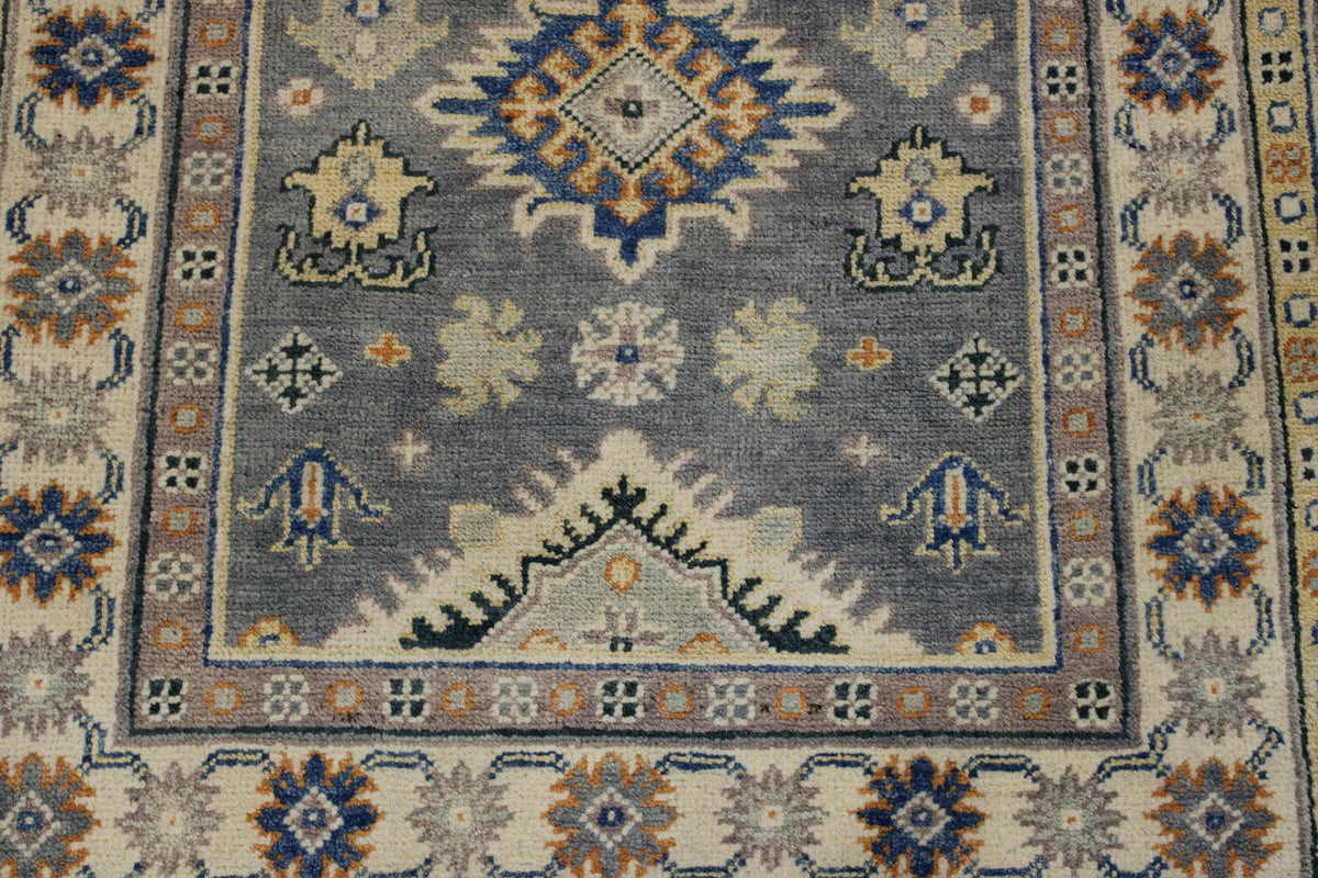 Tribal Super Kazak rug corner detail