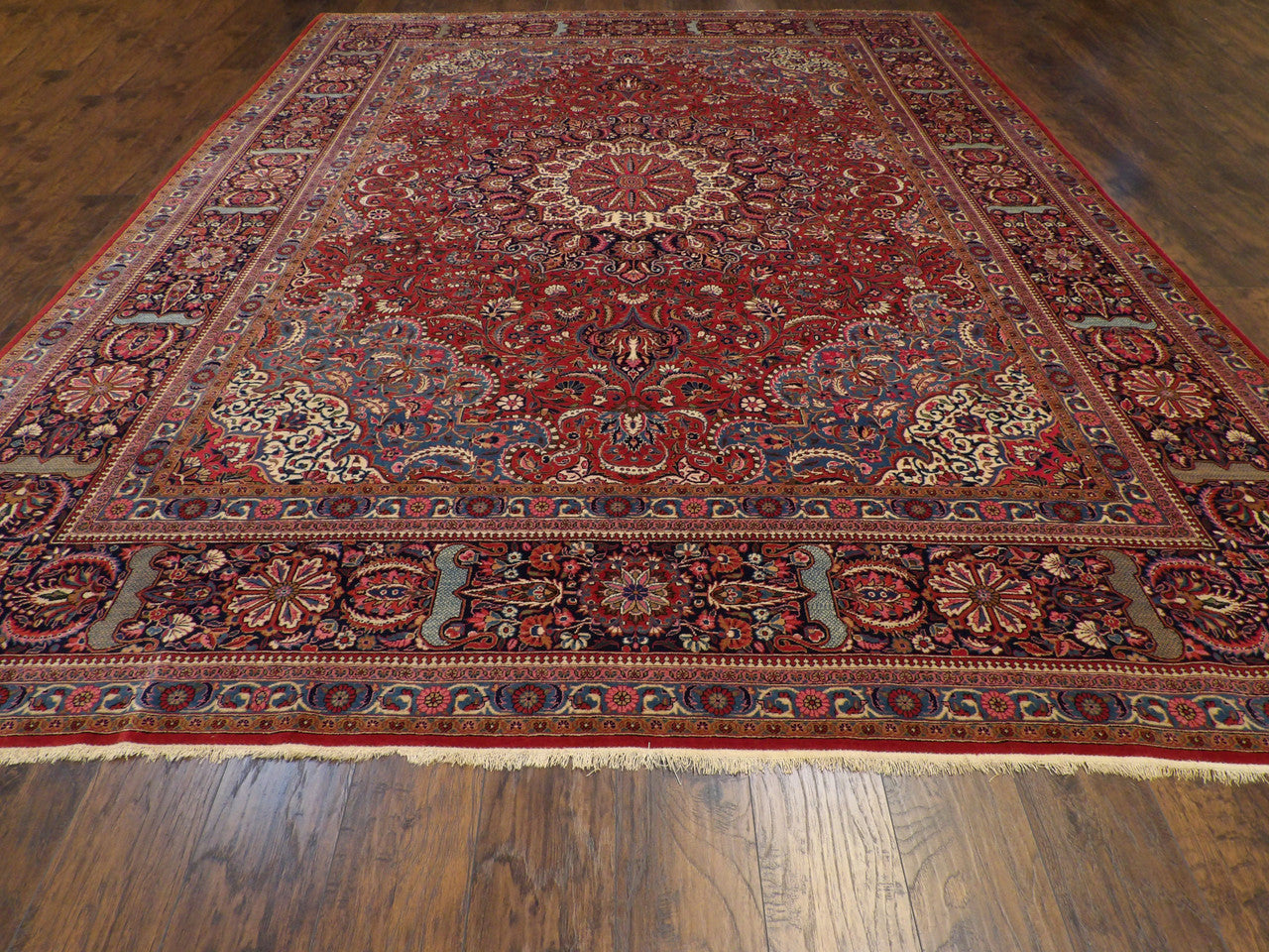 Antique Tabriz rug corner detail