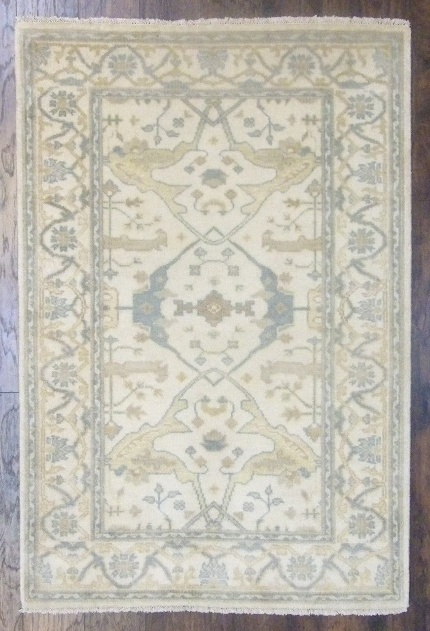 Turkish Oushak hand-knotted wool rug in beige, full view