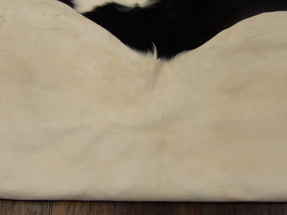 Full room view of Brazilian cowhide rug