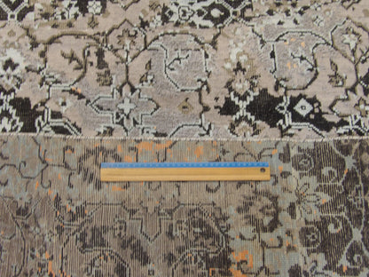Transitional black and blue rug in room setting