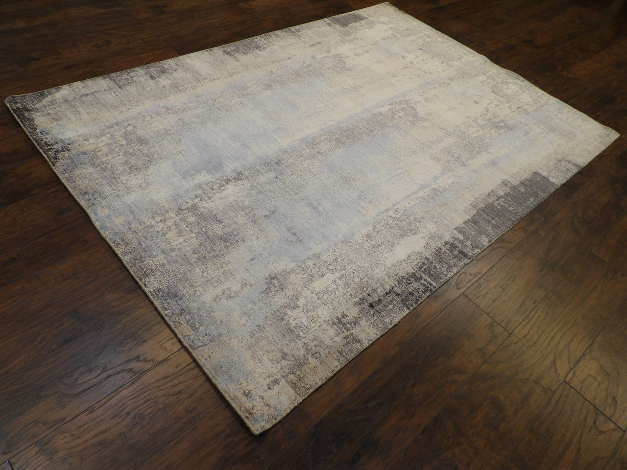 Abstract broken pattern detail, oxidized blue rug