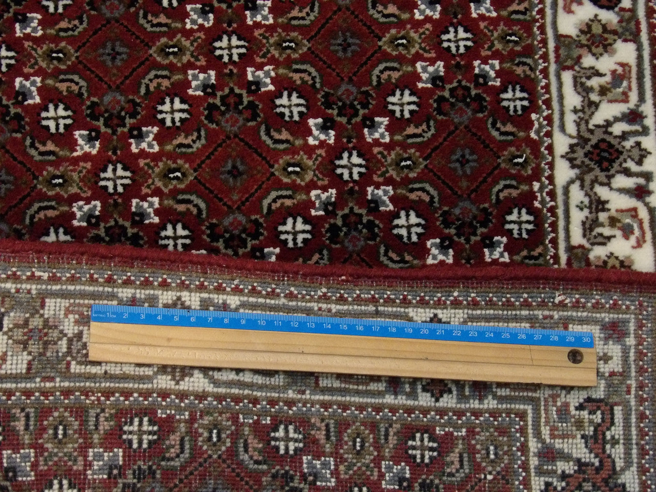 Beige and red Herati runner in hallway setting