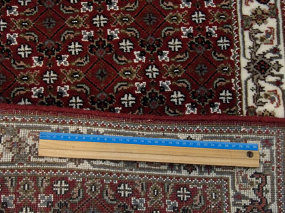 Beige and red Herati runner in hallway setting