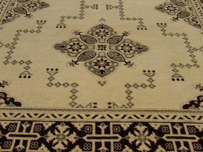 Oushak Kazak rug border detail, brown and ivory