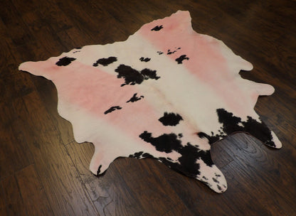 Pink cowhide rug in a room setting