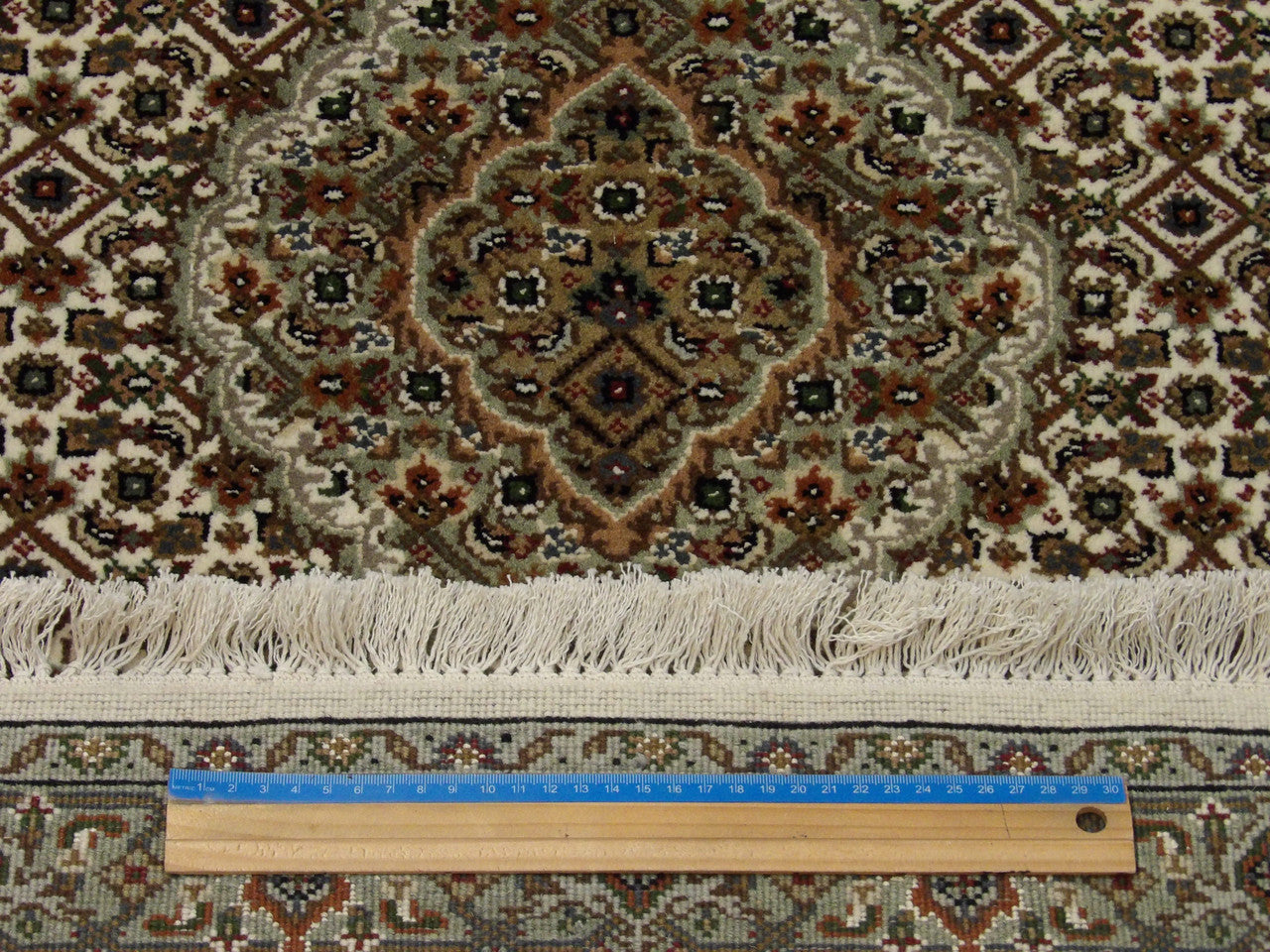 Black & Red Fine Persian Tabriz rug in room setting
