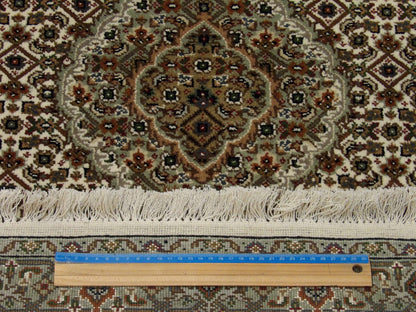 Black & Red Fine Persian Tabriz rug in room setting
