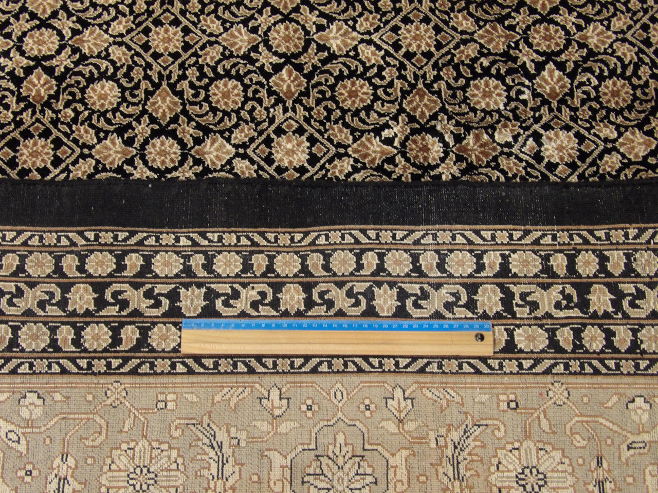 Black and beige Herati Mir rug in room setting