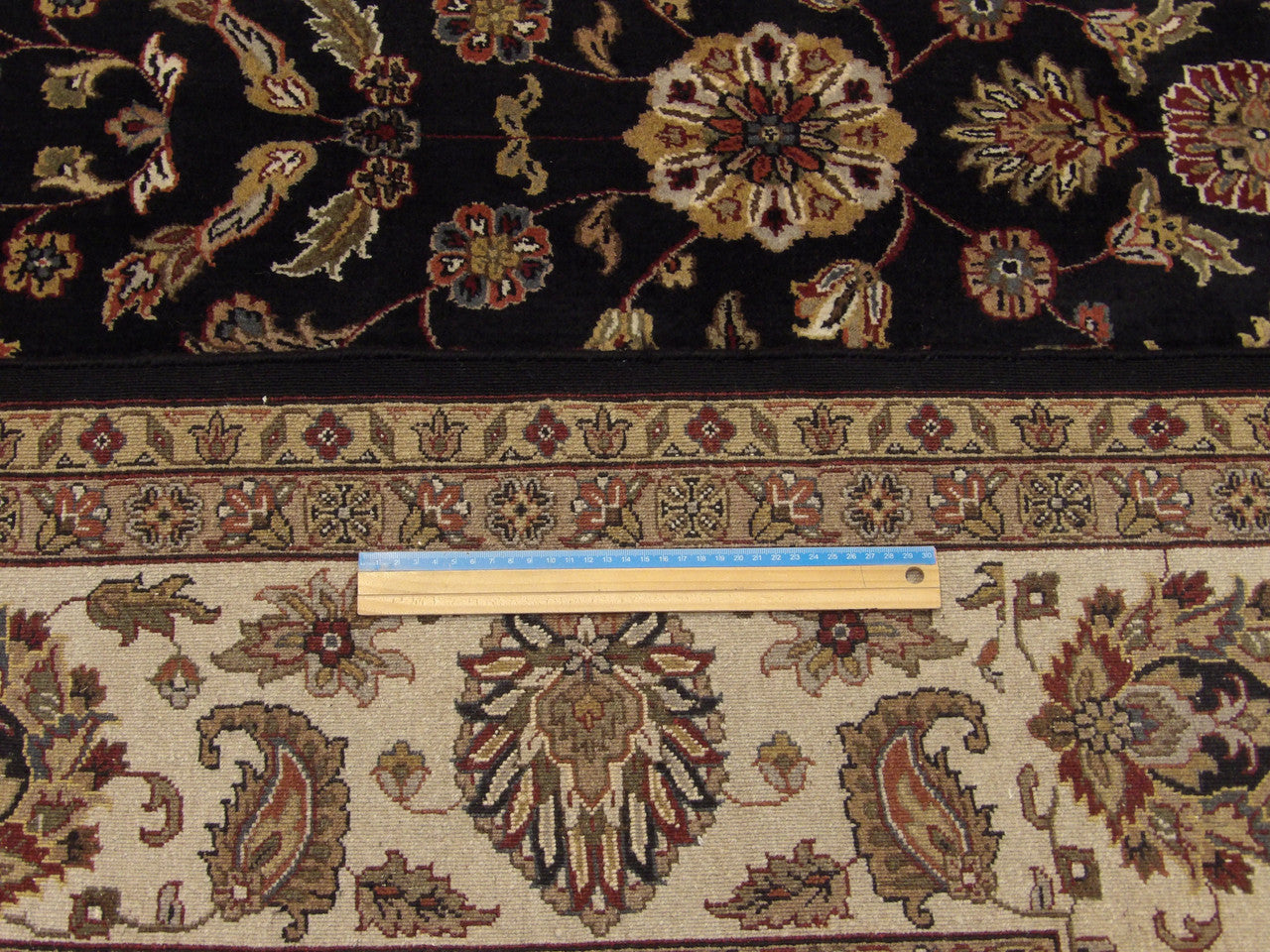 Black & Beige Fine Persian Mashad rug in room setting