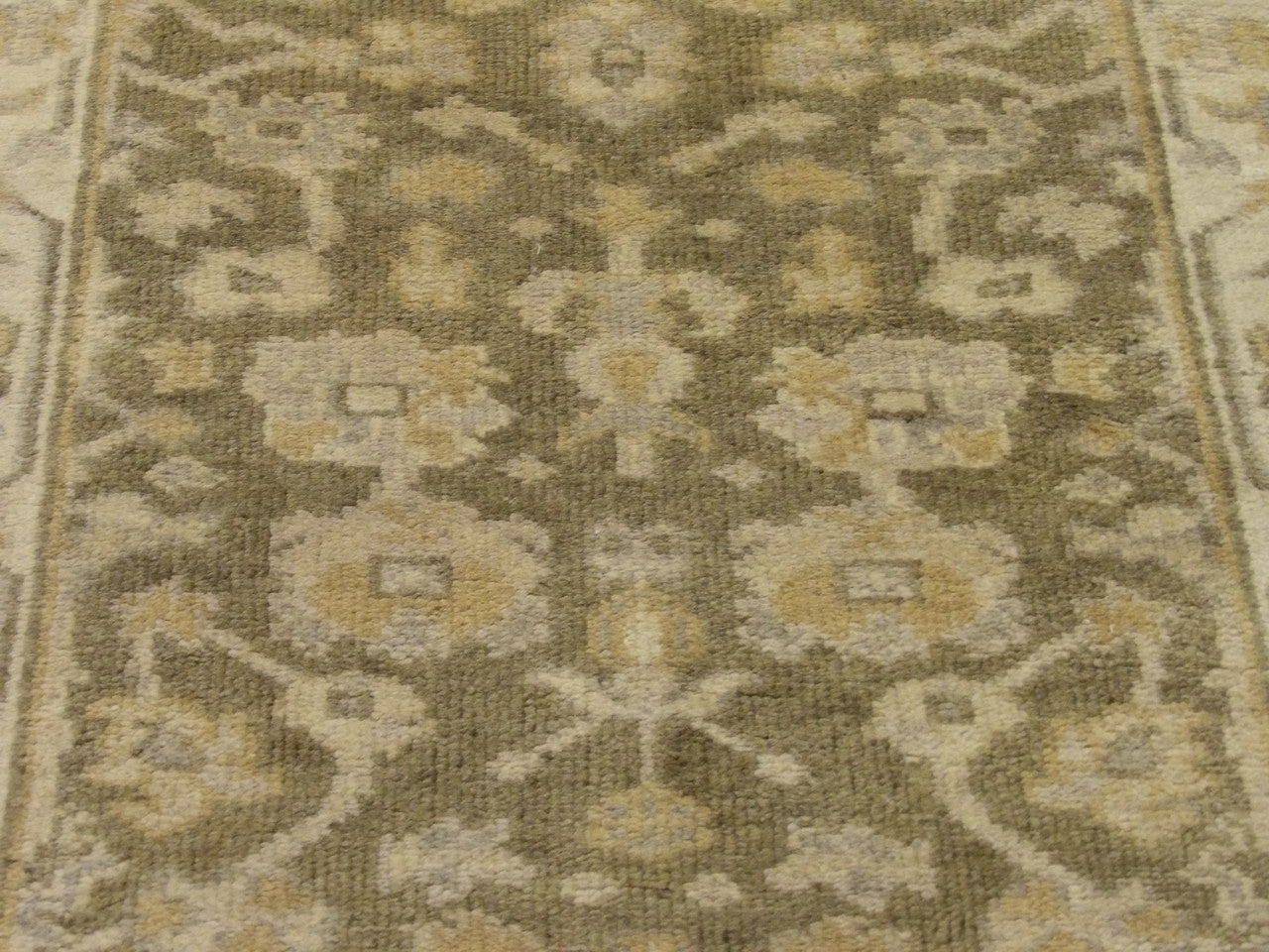 Natural dye wool texture close-up, green and beige