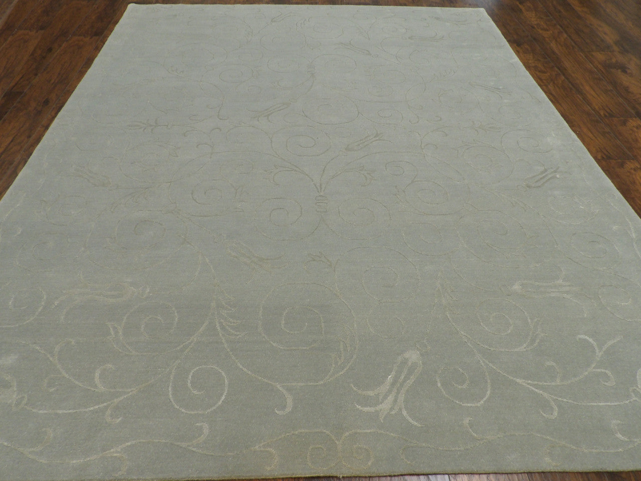 Close-up of wool-silk sheen on transitional floral rug