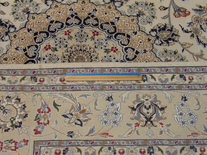 Beige Fine Persian Nain rug in room setting
