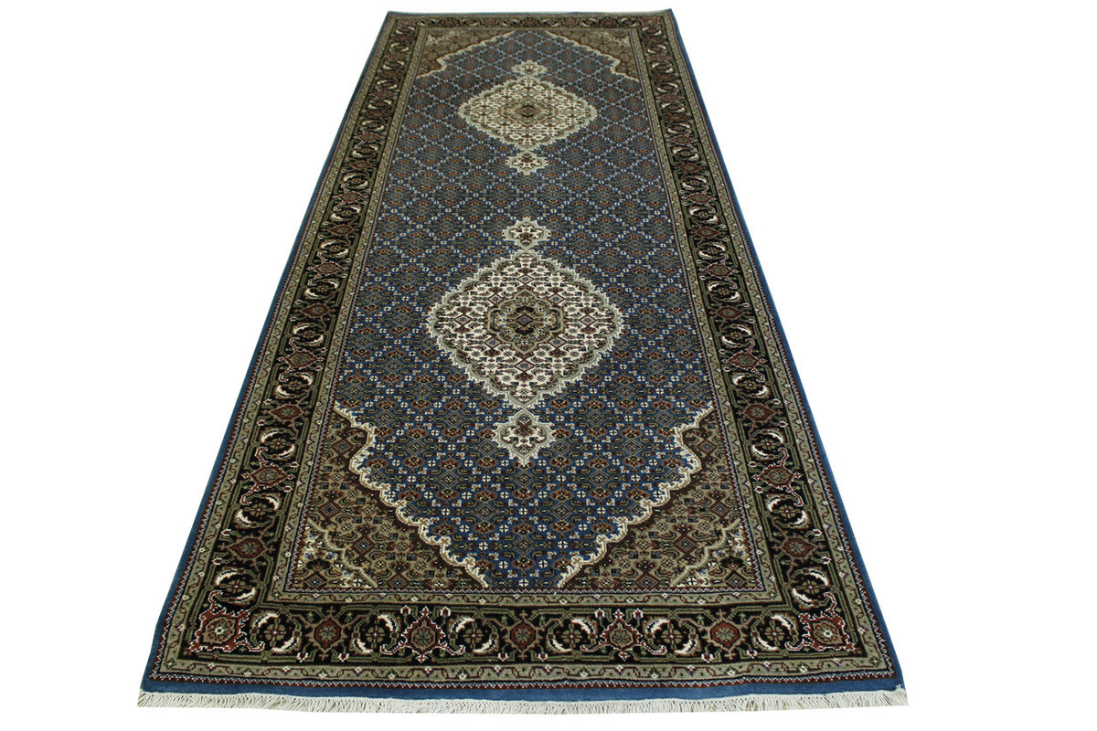 Traditional Tabriz rug border detail