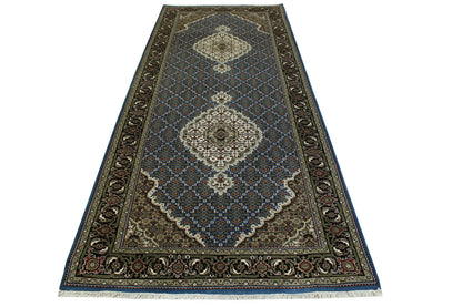 Traditional Tabriz rug border detail