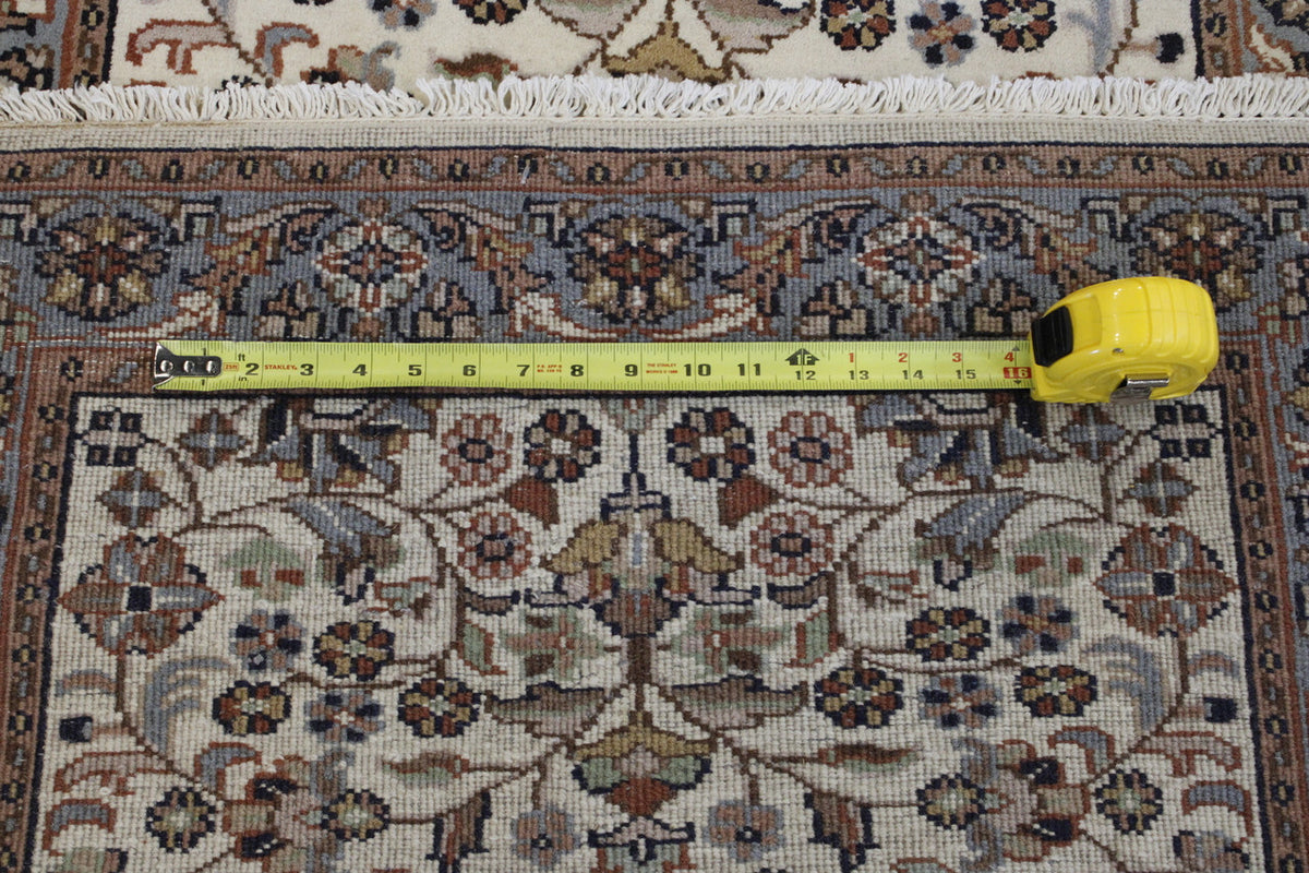 Beige Traditional Fine Herati rug in room setting