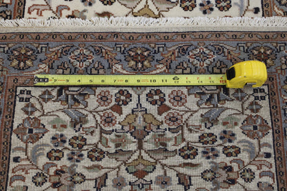 Beige Traditional Fine Herati rug in room setting