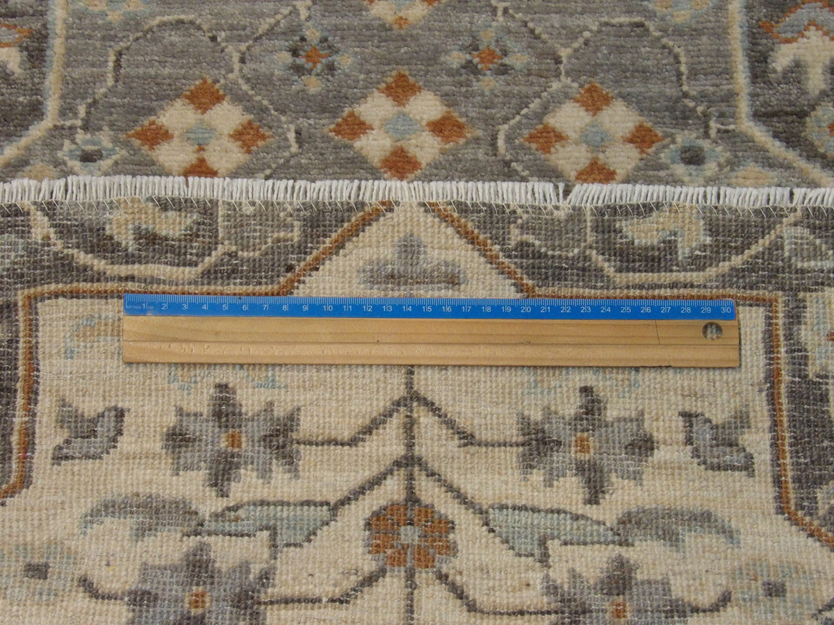 Brown & Beige Oushak Chobi rug in room setting