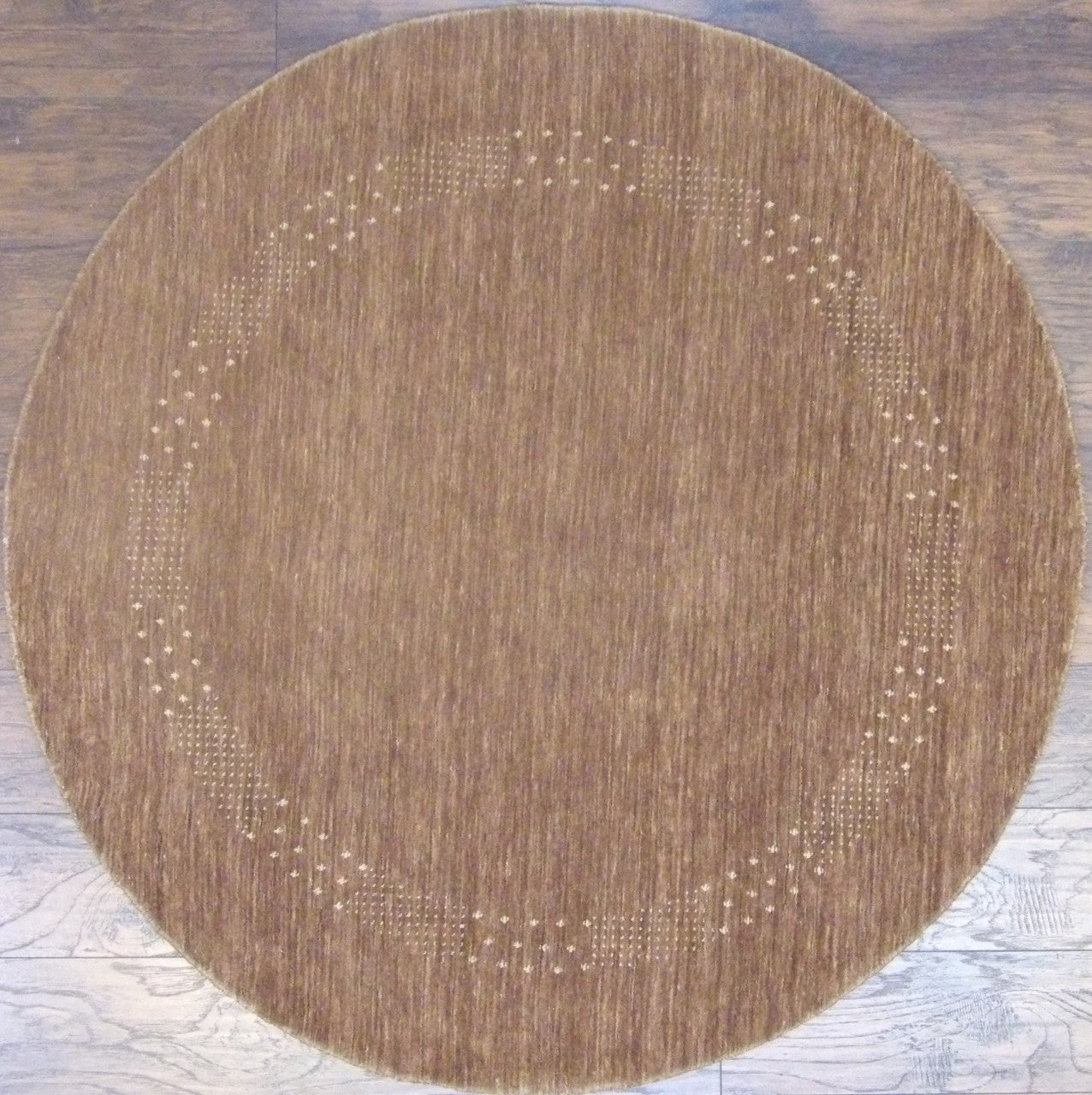 Modern Persian Gabbeh hand-knotted wool round rug in brown and beige, full view