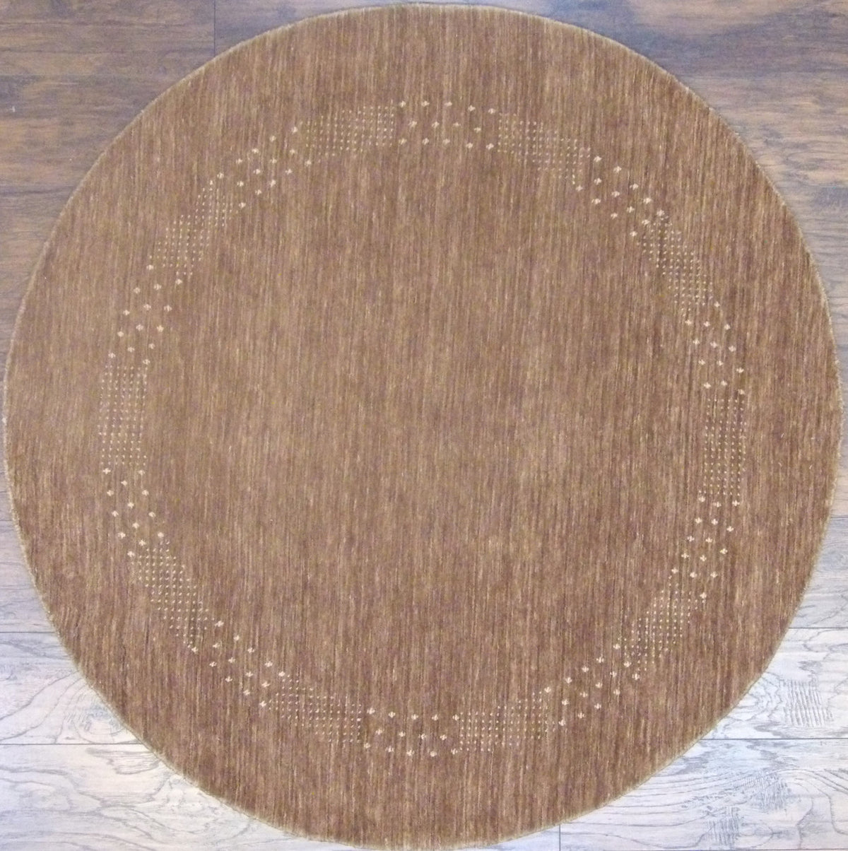 Modern Persian Gabbeh hand-knotted wool round rug in brown and beige, full view