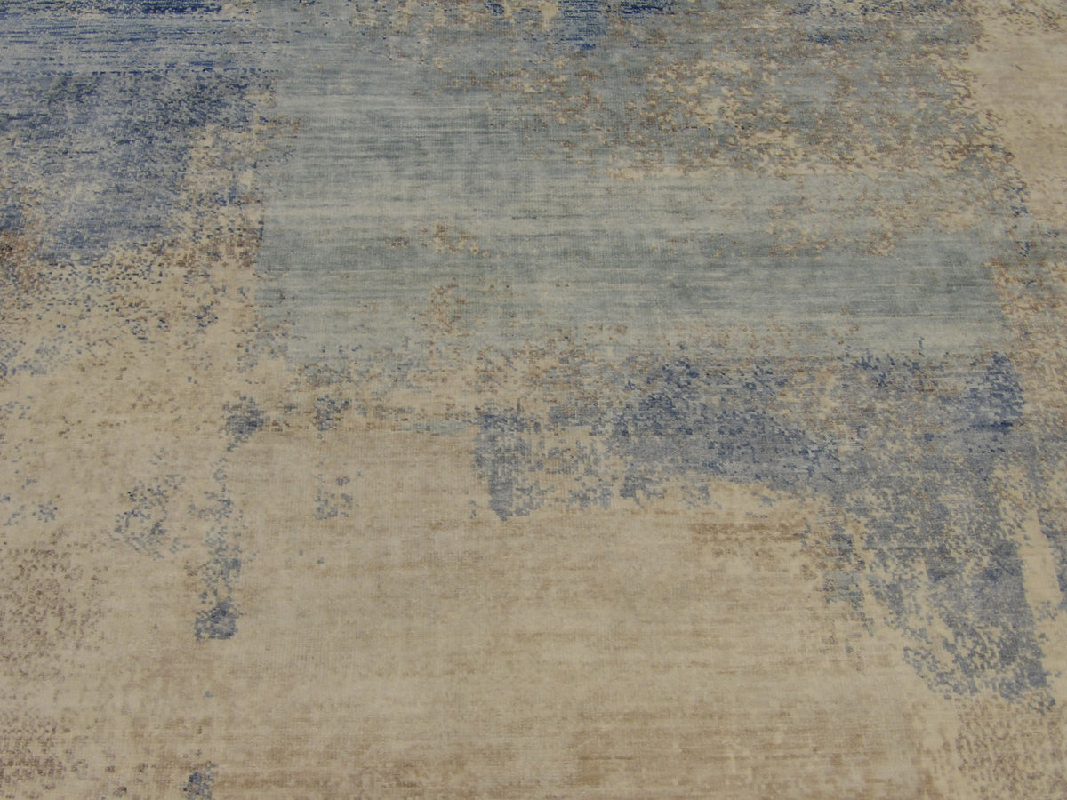 Transitional abstract rug edge detail, blue and brown