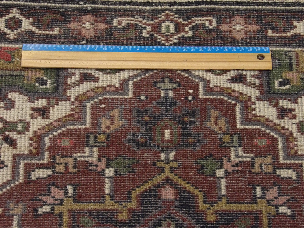 Black & Red Tribal Heriz rug in room setting