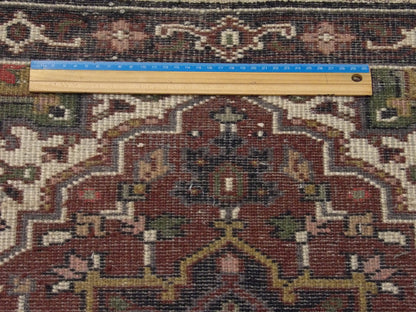 Black & Red Tribal Heriz rug in room setting